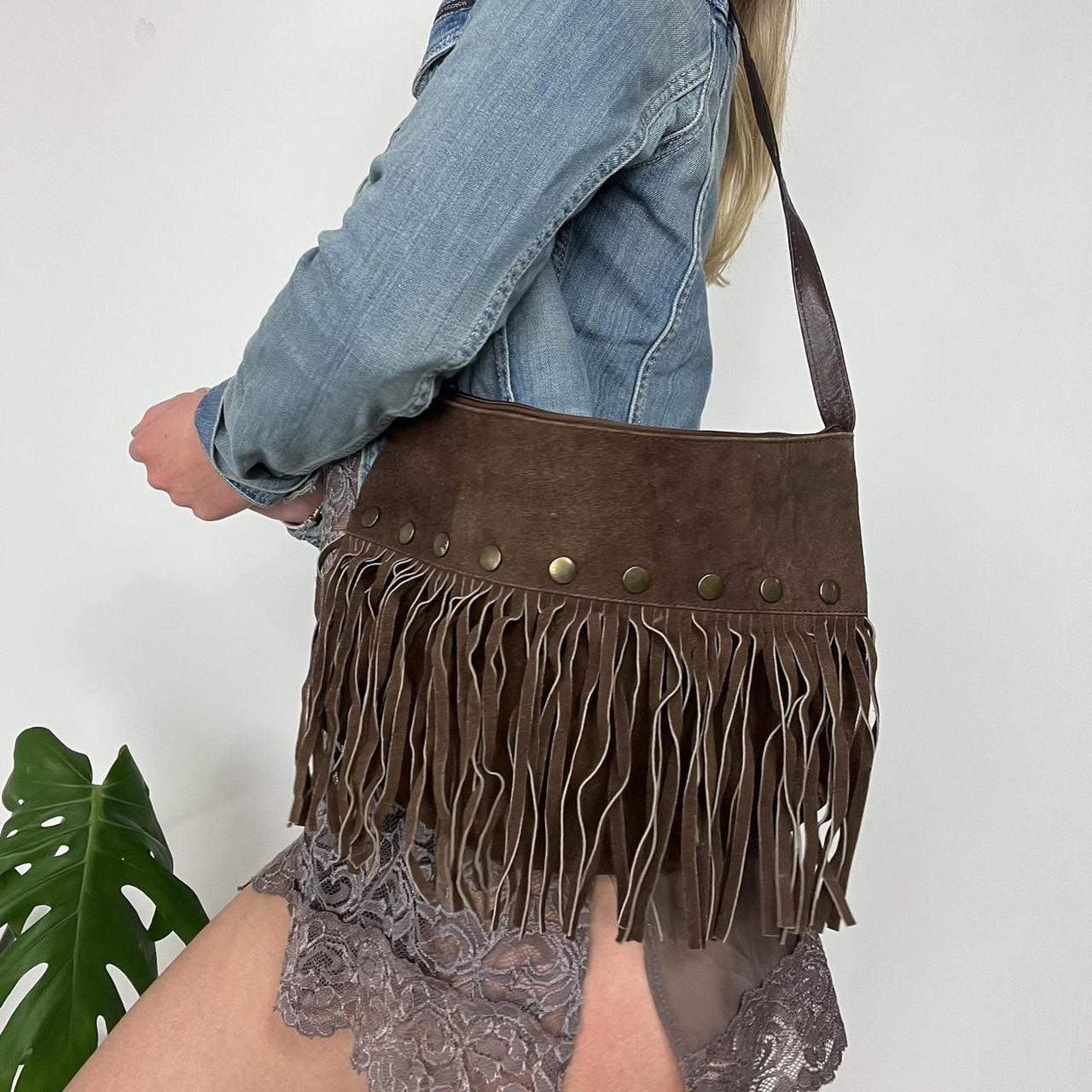 Suede tassel bag with metal stud features