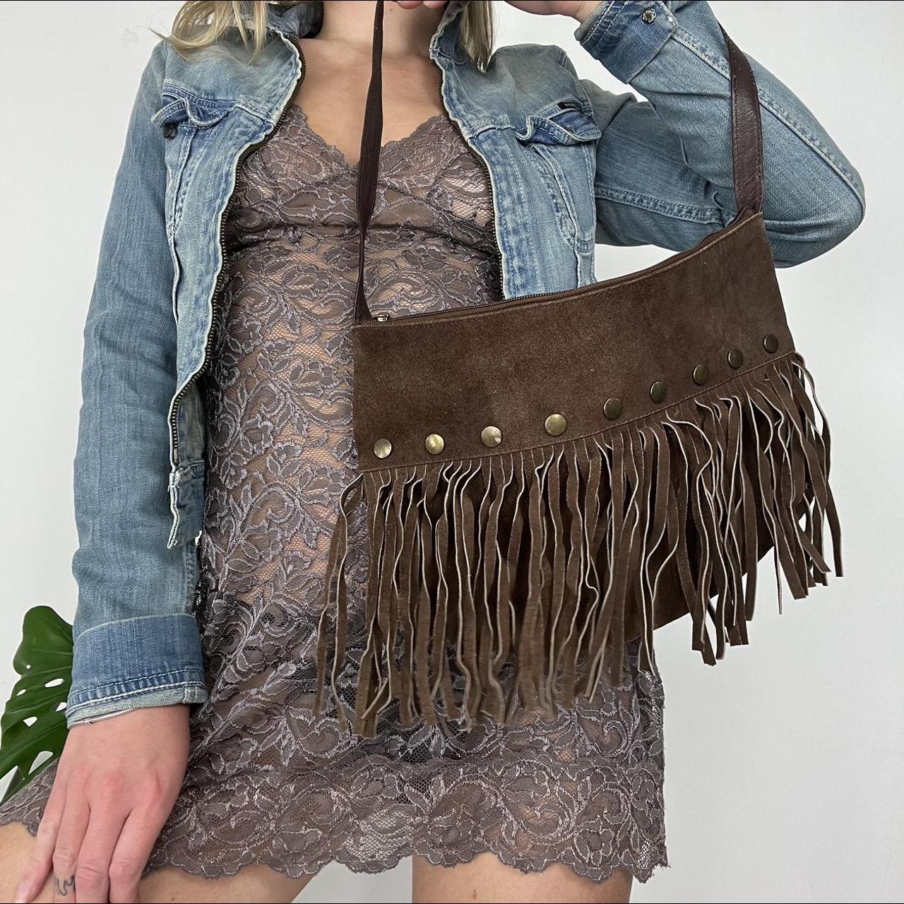 Suede tassel bag with metal stud features