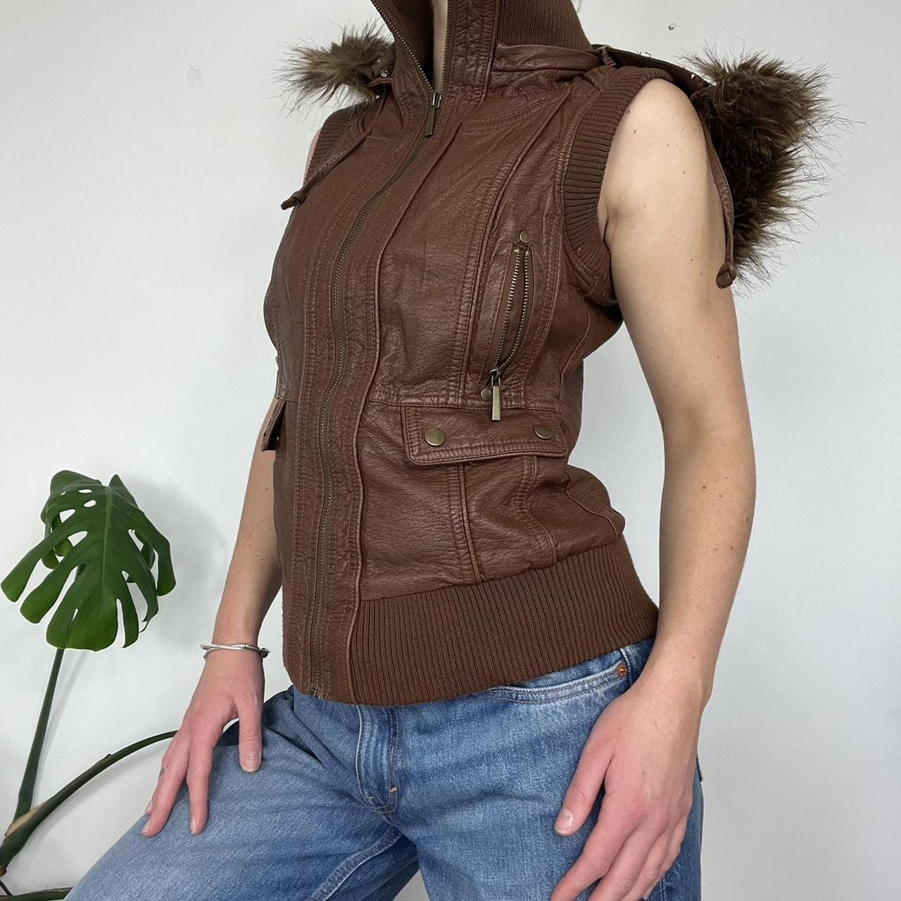 Leather gilet with fur trim hood