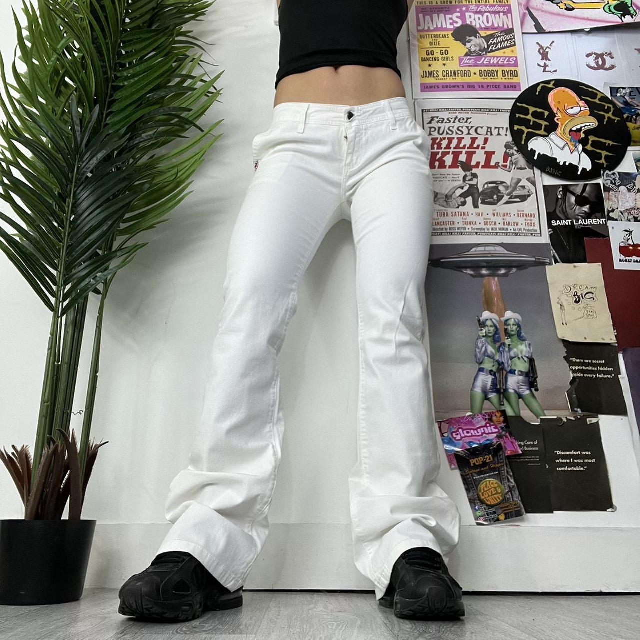 White denim low rise flared jeans