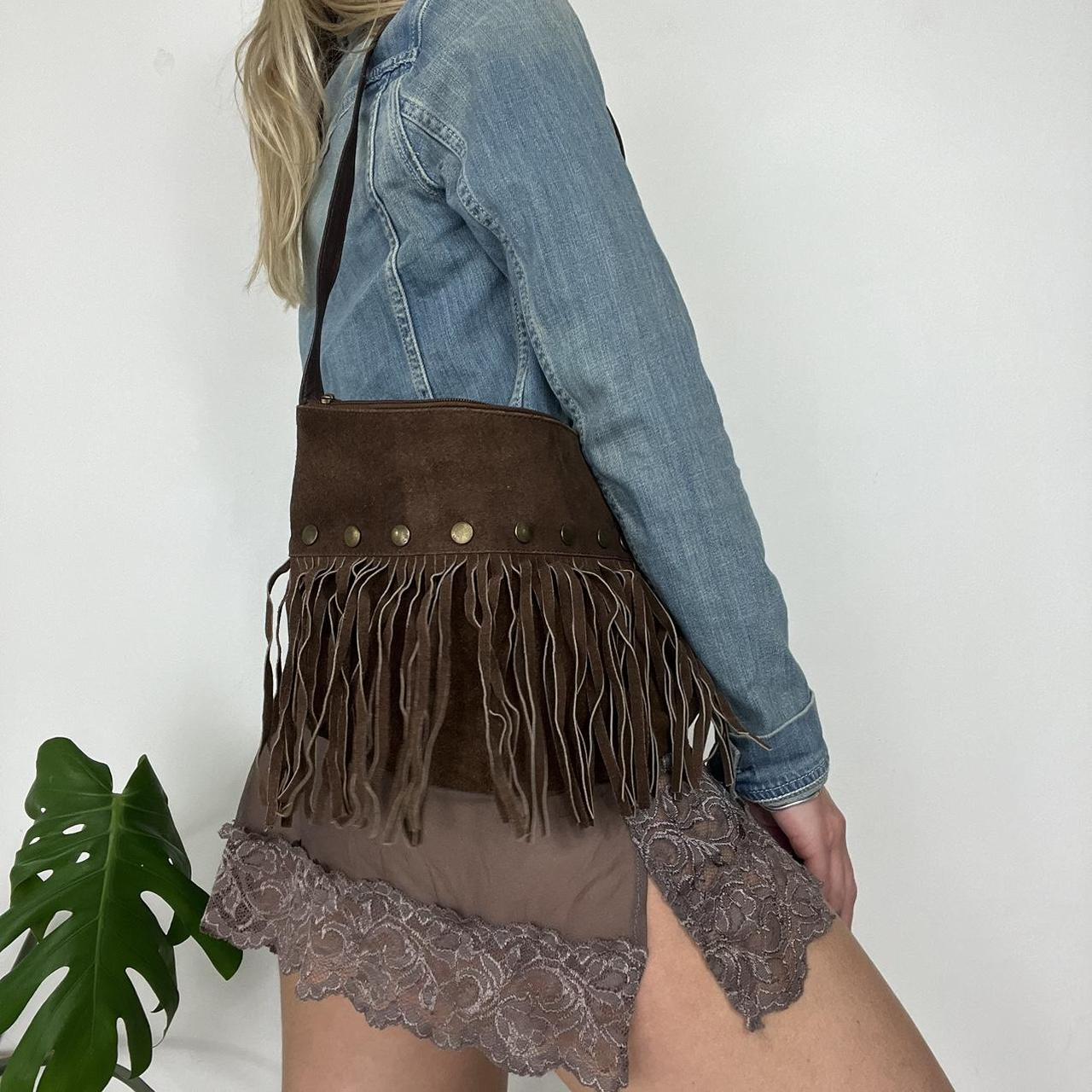 Suede tassel bag with metal stud features