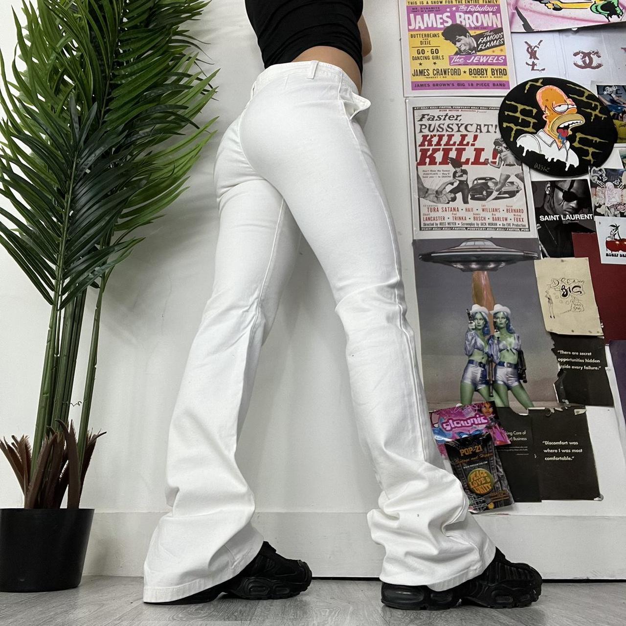 White denim low rise flared jeans